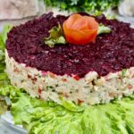 Rice salad with tuna and vegetables decorated with beetroot